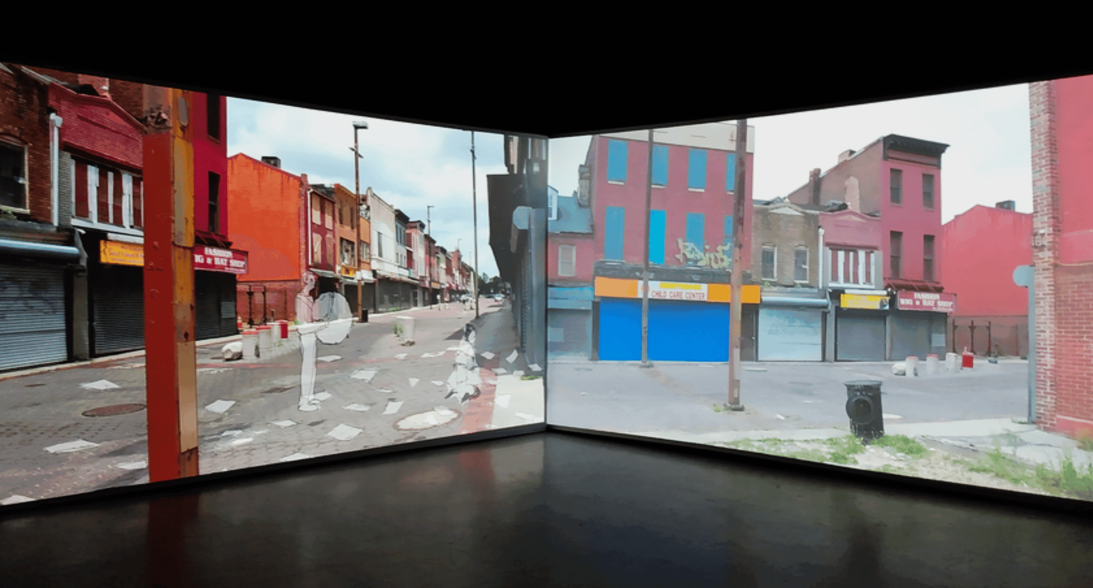 A work of modern art that displays two large projection screens featuring run-down cityscapes.