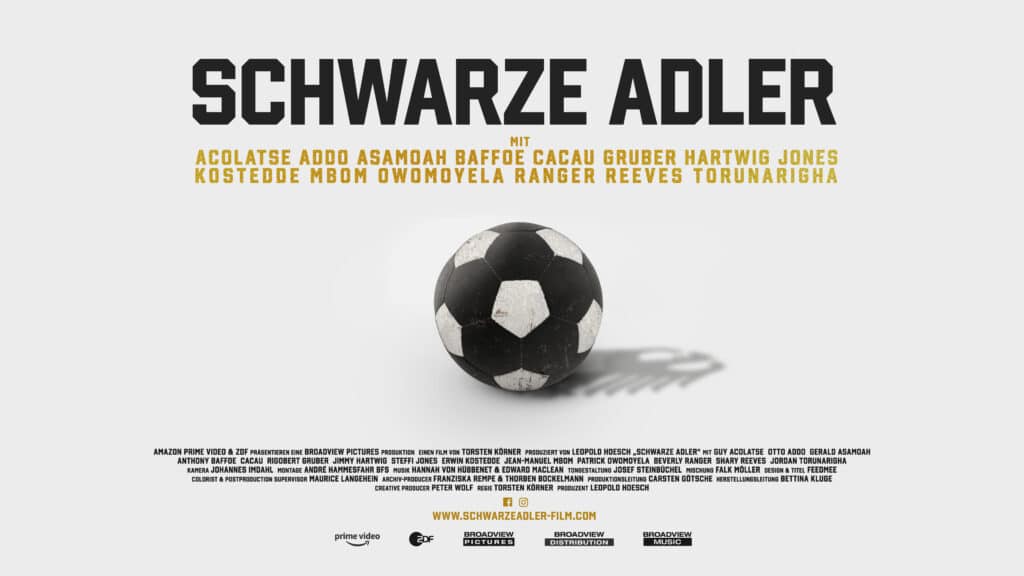 A film poster that features a black and white soccer ball and words in German.