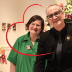 Kim Domanski appears in a green dress with a heart around her face.